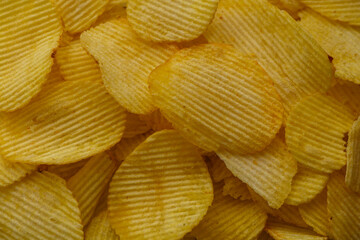 Potato chips in a plate as textured background