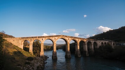 Fototapeta premium Ancient Ottoman Bridge Under the Open Sky: A Scenic Travel Landscape