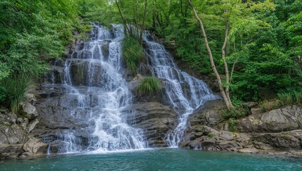 Maiden Tears Waterfall and Zhonka River surrounded by lush Carpathian mountains in summer, showcasing nature's beauty with trees and forest landscape