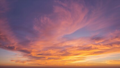 Fototapeta premium Breathtaking wide-angle view of dawn or dusk with gentle, vibrant clouds. Elevated perspective of twilight and early sunlight. Scenic natural backdrop.