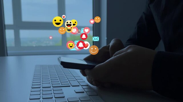 Social media,marketing, like,social network,blog,live,chat reaction and livestream.Person using smart phone with emoticon icons of Social Media.Interactive with friends on chat with emoticon feedback. - Powered by Adobe