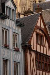 Colorful historic buildings and detailed stone architecture in Rouen, France. Charming medieval street scene showcasing European culture, history, and heritage.