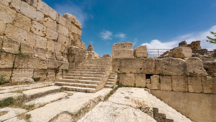 Fototapeta premium Ancient stone ruins with stairs under blue sky