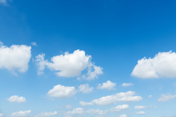 Background of blue sky with some white clouds