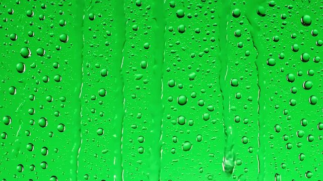 Chroma Key Visual Effect with rain drops falling down on glass green screen background water droplets window distortion, overlay, glitch, static noise, scan lines black background, 4k animated video