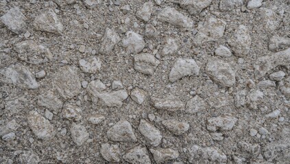 Obraz premium Wall with a textured surface and a background of small pebbles