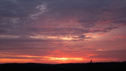 Fototapeta premium Evening Sky Filled with Clouds at Sunset