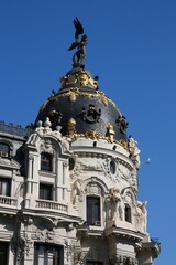 Metropolis building in Madrid city, Spain. Architecture of Madrid, Spain. Romanesque Revival old architecture style.