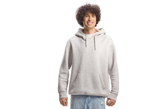 Guy with curly hair in a gray hoodie and jeans