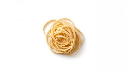 Stack of raw dry durum wheat fettuccine pasta on a white backdrop