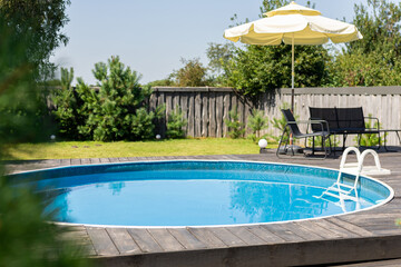 Luxurious backyard with modern blue swimming pool