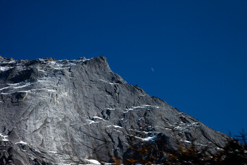 mountain summer landscape. meadow with huge stones among the grass on top of the hillside near the peak of mountain range
