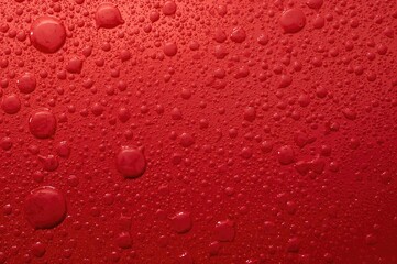 Abstract oil bubble design on a crimson background wallpaper