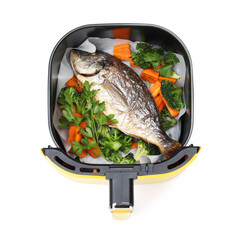 Grilled fish and vegetables in air fryer basket isolated on white, top view