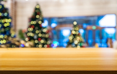 Wood table in front of Christmas trees