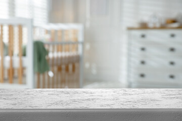 Empty table in baby room. Space for design