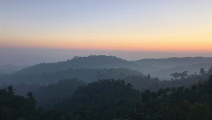 Morning fog over mountain landscapes Captivating natural views from a lush region Picture showcasing pristine and peaceful environment used for travel promotion