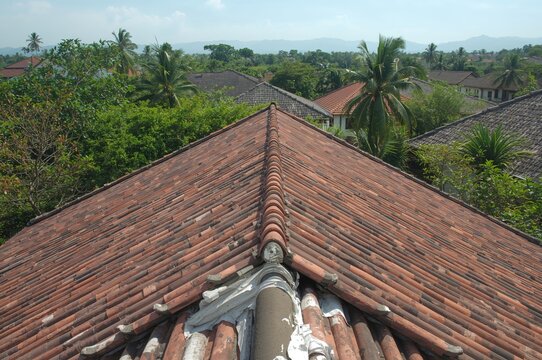 Clay Tile Roof Shapes on Traditional Buildings with Metal-Covered Edges for Rain Protection