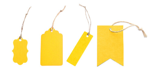 Yellow tags of different shapes isolated on white, set. Top view