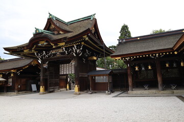Obraz premium A Japanese shrine : the scene of a gate to Honden Main Hall in the precincts of Kitano-tenmangu Shrine in Kyoto City