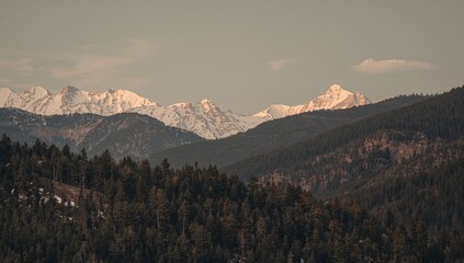 Fototapeta premium Scenic panorama of forested hills and rugged cliffs at sunset