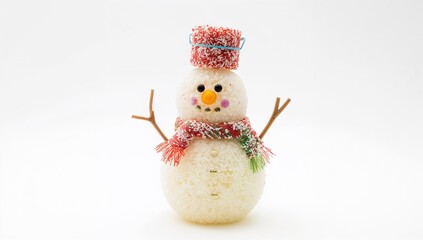 Obraz premium On a white backdrop, a happy snowman crafted from vegan coconut sweets wears a bucket as a hat.
