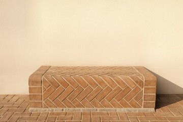 Fototapeta premium Herringbone Patterned Clay Bench In Minimalist Outdoor Setting With Natural Light And Simple Geometry Emphasizing Earthy Tones And Texture