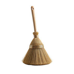 A natural-fiber broom stands upright against a stark black background