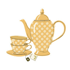 Yellow vintage teapot with two teacups and teabag