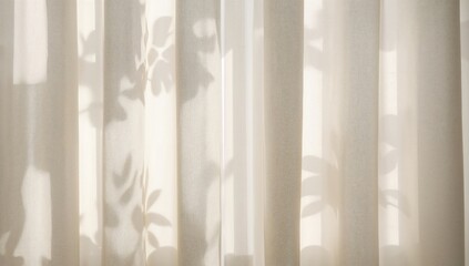 Close-up of beige linen curtains with sunlight casting delicate leaf shadows in a cozy morning setting