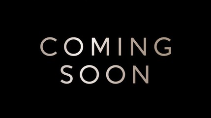 Coming Soon - Minimalist dark background with thin uppercase coming soon text in center spotlight