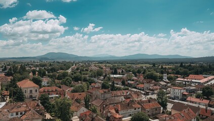 Obraz premium Bird's-eye perspective of a small town in a mountainous region