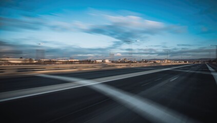 Fototapeta premium Out-of-focus white and black road near a transit point