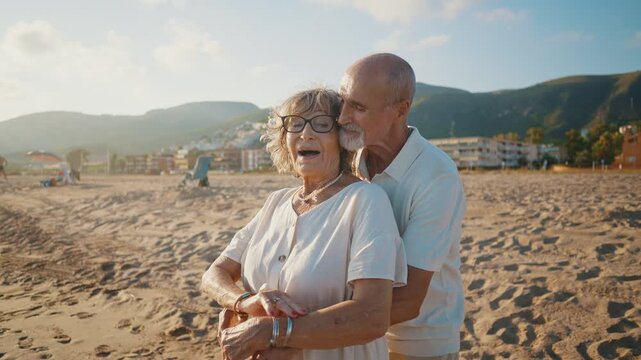 Happy senior couple embracing and enjoying a romantic moment on the beach during a beautiful sunset, celebrating a lifetime of love and companionship together during their golden years