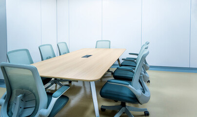 Meeting room with big table and armchair