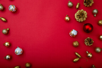 Elegant Christmas background with golden and red ornaments. Space for text or logo in the center.