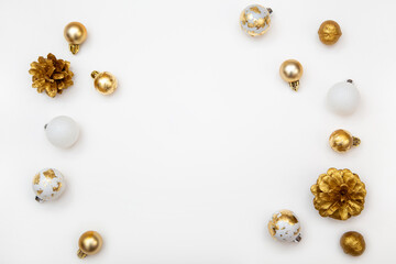 White Christmas background with copy space and golden decorations. Stylish minimalist composition for cards, banners and holiday ads.