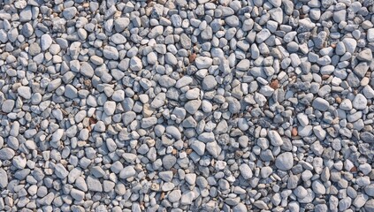 Obraz premium Close-up of tiny light gray stones on the surface