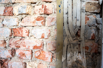 Open interior space with exposed red brick, combining raw materials and industrial charm