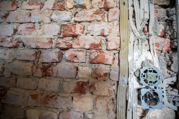 Open interior space with exposed red brick, combining raw materials and industrial charm