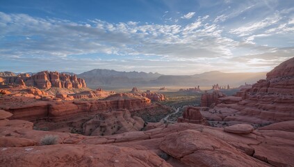 Scenic mountain landscape with vibrant red rock formations under a clear sky