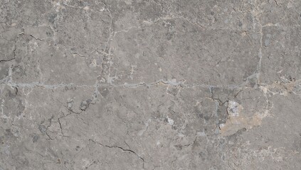 Aged coarse cement surface with eroded rock design, detailed close-up.