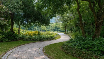Obraz premium Stone-paved paths wind through lush greenery in a garden setting