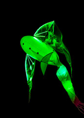 Long exposure of brightly lit objects floating in the night sky