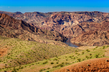 Green graces the hills along US Highway 93 in western Arizona along the Colorado River