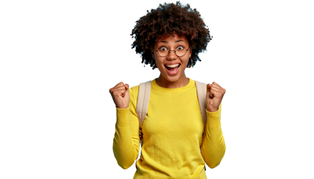 Joyful woman with curly hair wearing a yellow shirt and glasses, expressing excitement against a black background