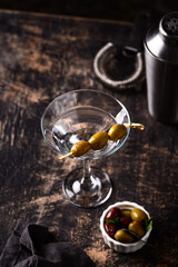 Traditional martini cocktail with olives and