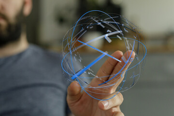Close up of a man holding a digital globe, representing technology, innovation, and global connectivity. Perfect for business, tech, and future-