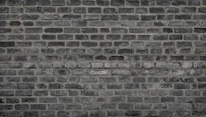 Fototapeta premium A continuous gray brick surface. Brick pattern background or texture, abstract dark designs on bricks