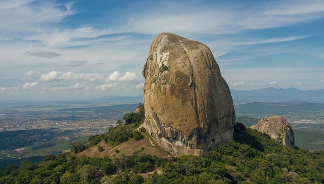 Aerial view of a massive granite formation in a natural setting